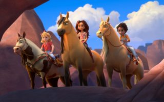 (from left) Abigail Stone (Mckenna Grace) riding Boomerang, Lucky Prescott (Isabela Merced) riding Spirit and Pru Granger (Marsai Martin) riding Chica Linda in DreamWorks Animation’s Spirit Untamed, directed by Elaine Bogan.